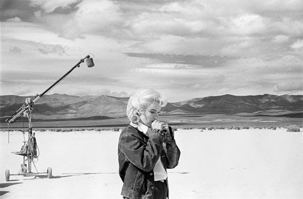 Marilyn Monroe in the Nevada desert going over her lines for a difficult scene she is about to play with Clark Gable in the film “The Misfits”, Nevada, USA, 1960 C Eve Arnold / Magnum Photos