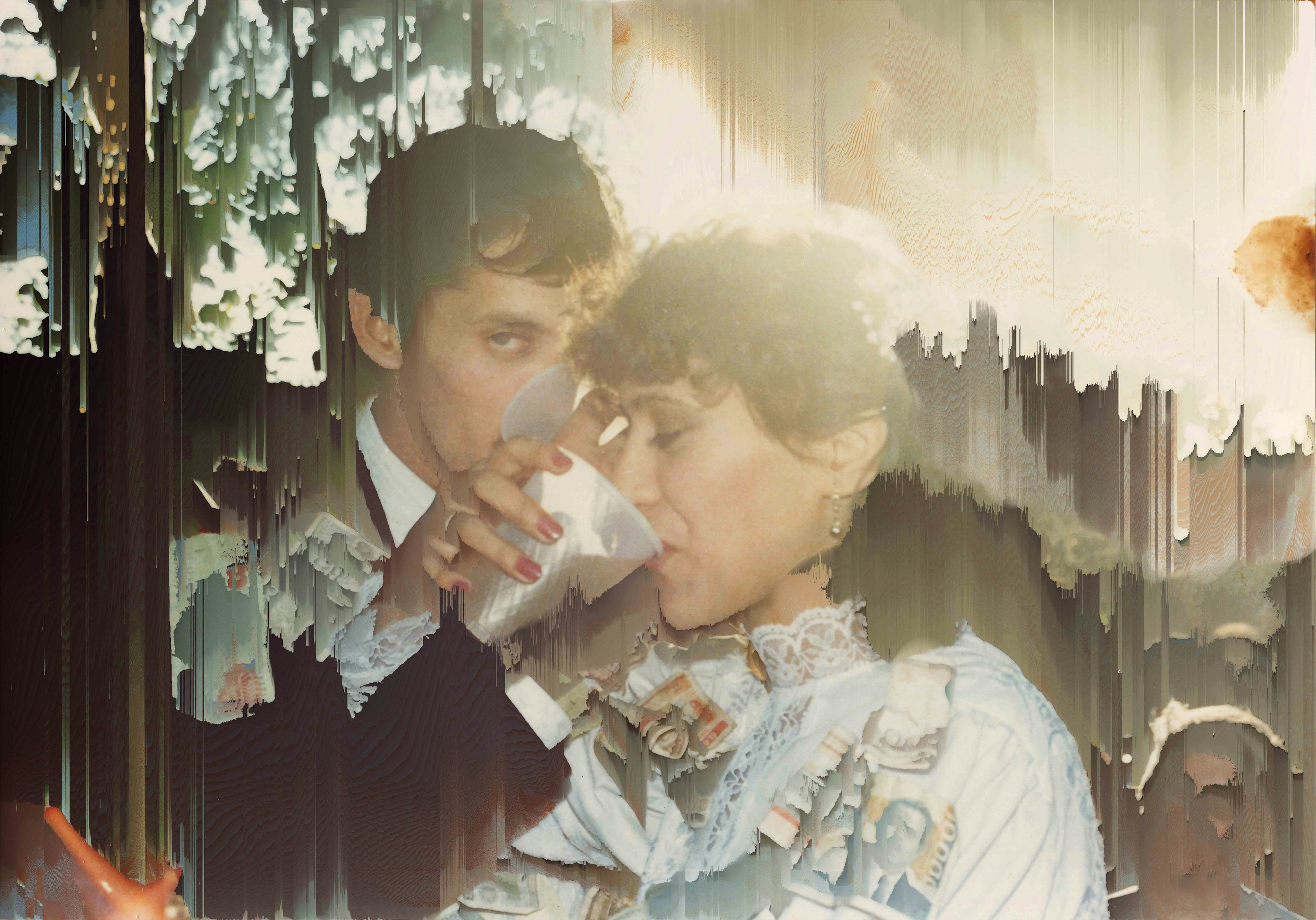 Archival image of the artist's parents wedding, showing them drinking from a cup whilst interlocking arms. The pixels are manipulated in a way that appears to wipe out the photograph© Cristóbal Ascencio Ramos