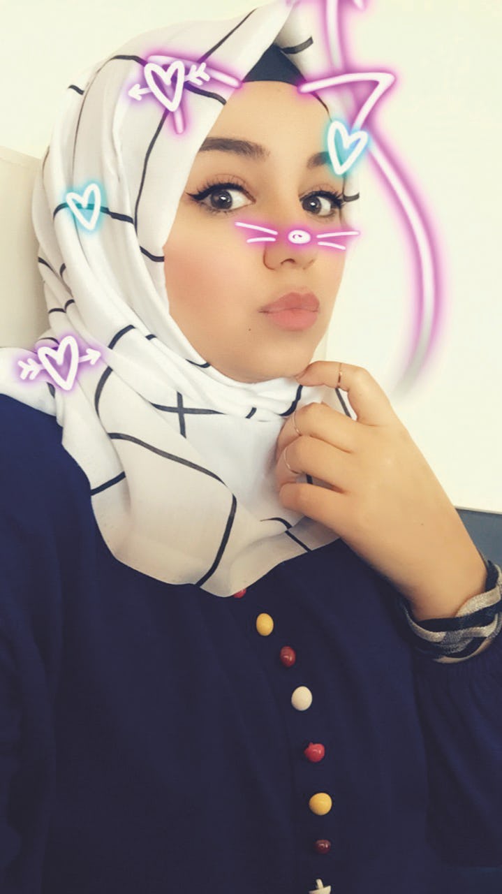 Selfie image with a filter, showing a Iraqi woman wearing a white hijab