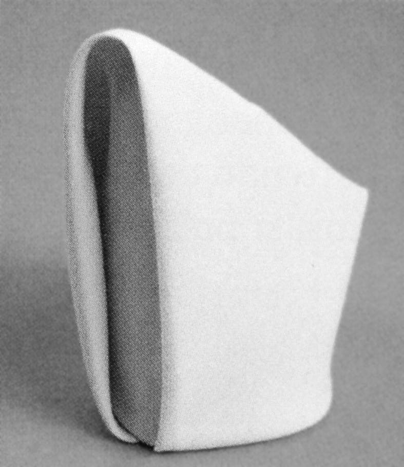 Black and white image of a folded napkin. © Eleonora Agostini