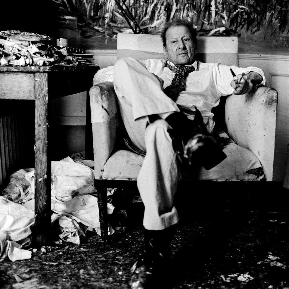 black and white photograph of Lucian Freud in a chair